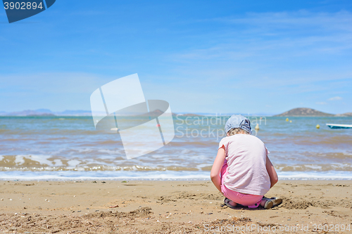 Image of Little girl playing on the Mar Menor beach