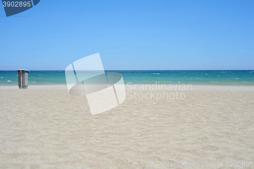 Image of Garbage container on sandy beach Mediterranean sea