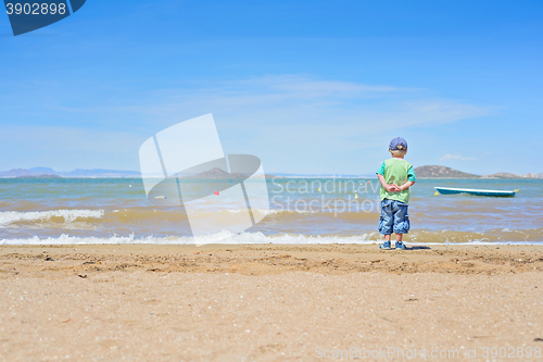 Image of Small boy standing on the beach near Mar Menor