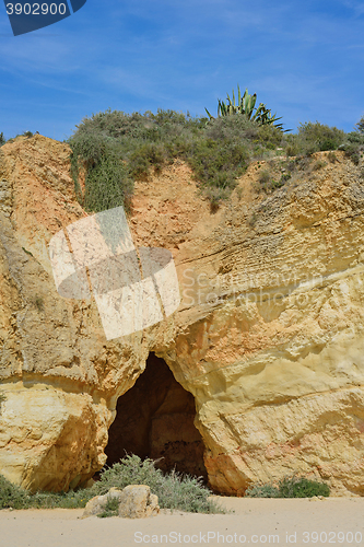 Image of Rock, cave and sky in praia da Rocha, Algarve