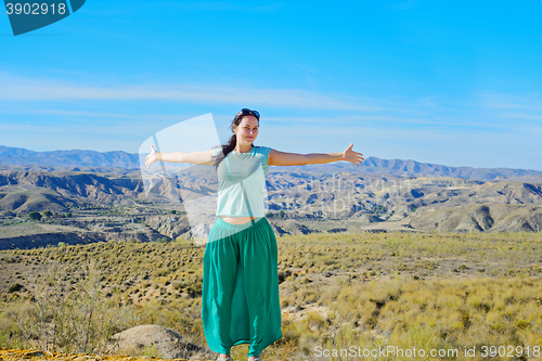 Image of Happy woman open arms stand at mountain