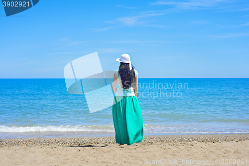 Image of Brunette with long hair turned away