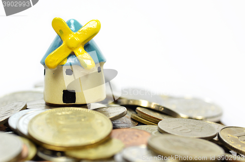 Image of House and money over white