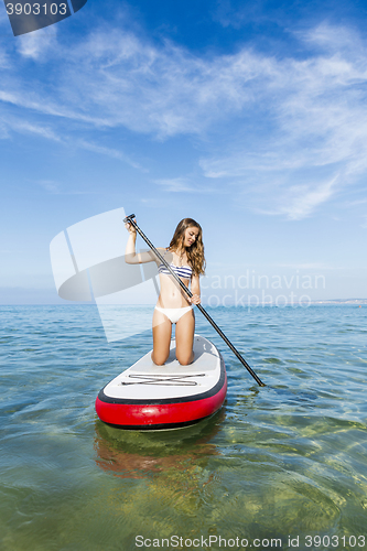 Image of Woman practicing paddle