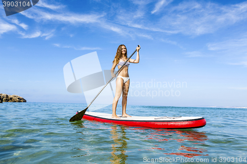 Image of Woman practicing paddle