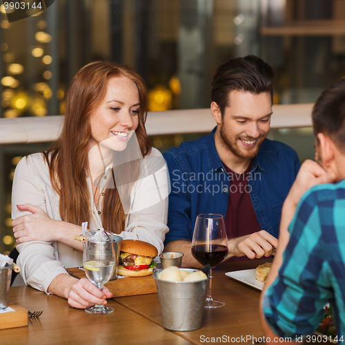 Image of friends at restaurant having dinner