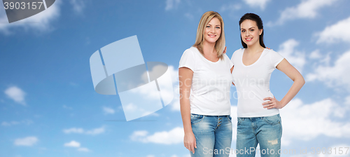 Image of group of happy different women in white t-shirts