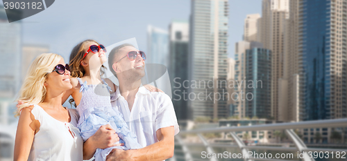 Image of happy family over dubai city street background