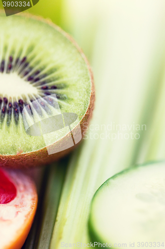Image of close up of ripe kiwi and cucumber slices