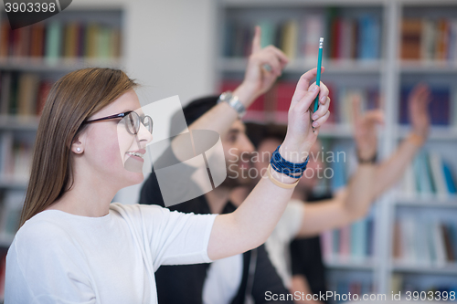 Image of group of students  raise hands up