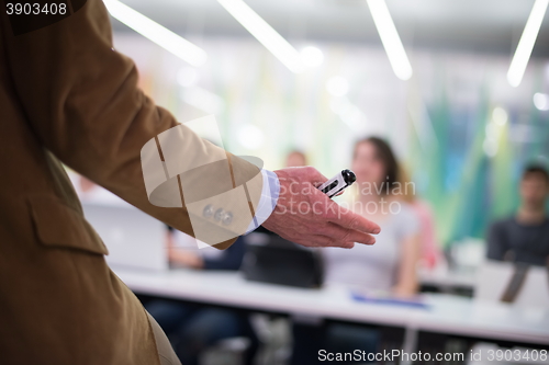 Image of close up of teacher hand while teaching in classroom