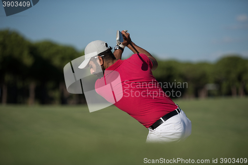 Image of golfer hitting a sand bunker shot