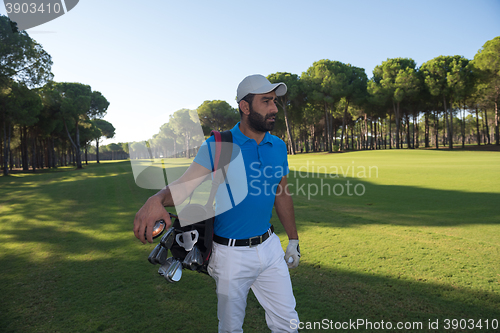 Image of golf player walking