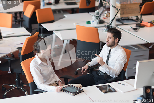 Image of business couple working together on project