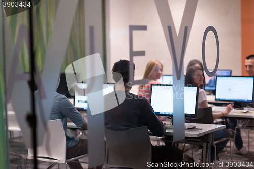 Image of technology students group working  in computer lab school  class