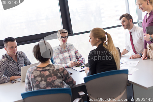 Image of young business people group on meeting at modern office