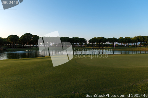 Image of golf course on sunset