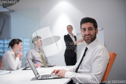 Image of young business man at meeting