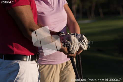 Image of portrait of couple on golf course