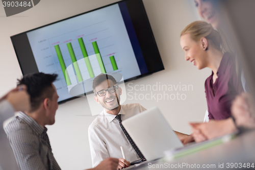 Image of young business people group on team meeting at modern office