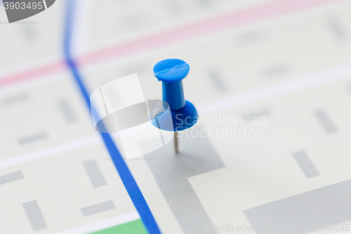 Image of close up of map or city plan with pin