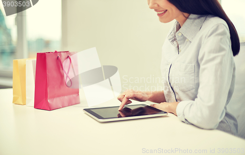 Image of close up of woman with tablet pc at office