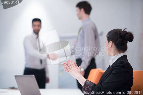 Image of young business woman on meeting  using laptop computer