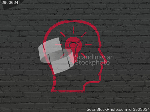 Image of Business concept: Head With Lightbulb on wall background