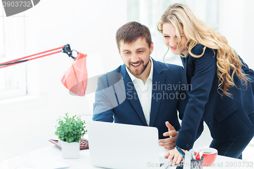 Image of Male and female office workers.