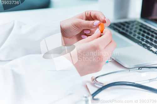 Image of The doctor hands with pill in hospital