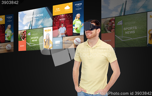 Image of happy man in virtual reality headset or 3d glasses
