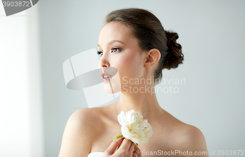 Image of beautiful asian woman with flower and jewelry