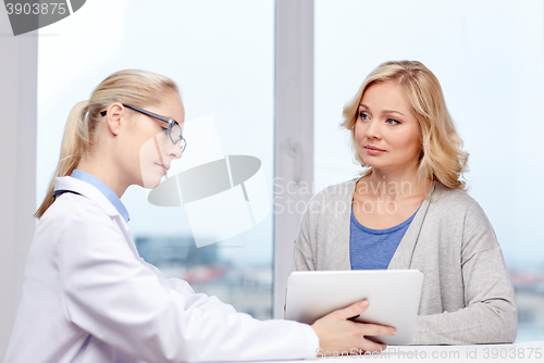 Image of doctor with tablet pc and ill woman at hospital