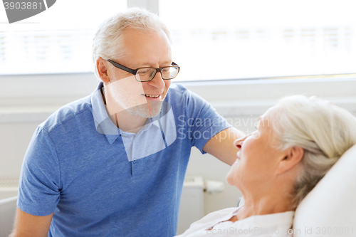 Image of senior couple meeting at hospital ward