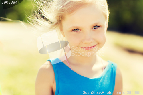 Image of happy little girl outdoors at summer