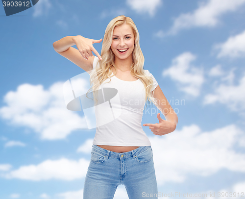 Image of happy young woman or teenage girl in white t-shirt