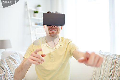 Image of young man in virtual reality headset or 3d glasses