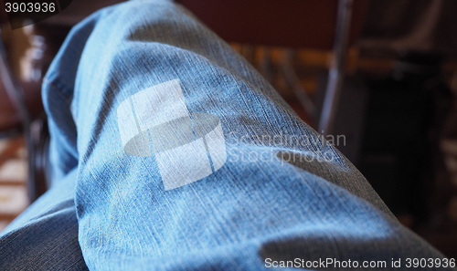 Image of Blue jeans man sitting