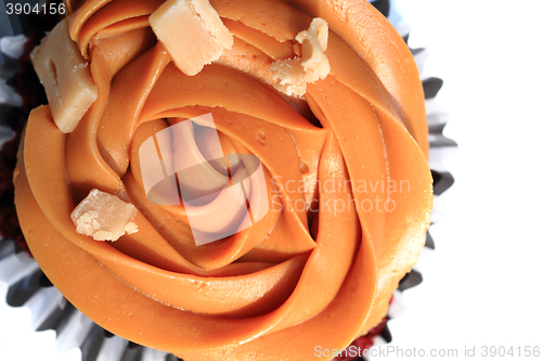 Image of caramel cupcake isolated