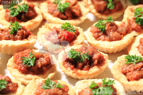 Image of raw meat with salted cookies