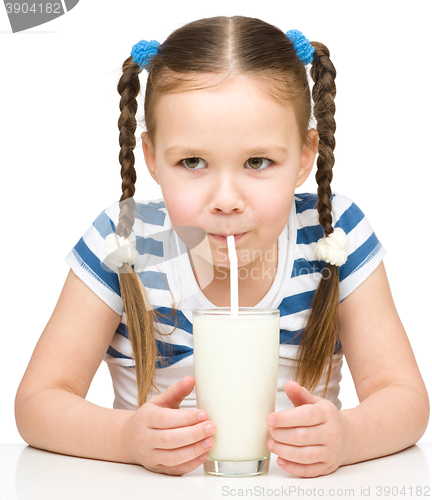 Image of Cute little girl with a glass of milk