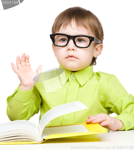 Image of Little child play with book