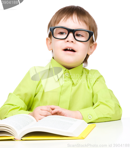 Image of Little child play with book