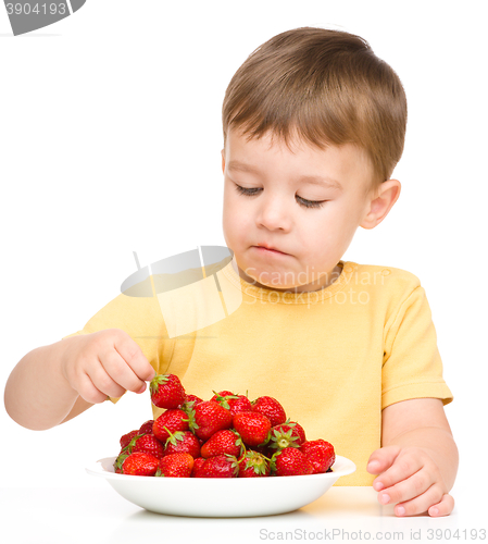 Image of Little boy with strawberries