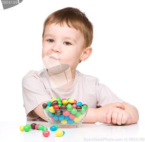 Image of Portrait of a boy with candies