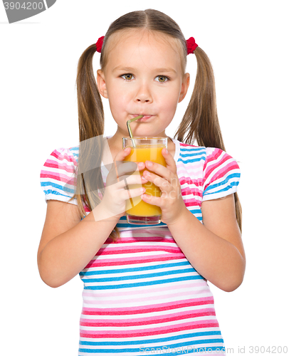 Image of Little girl is drinking carrot juice
