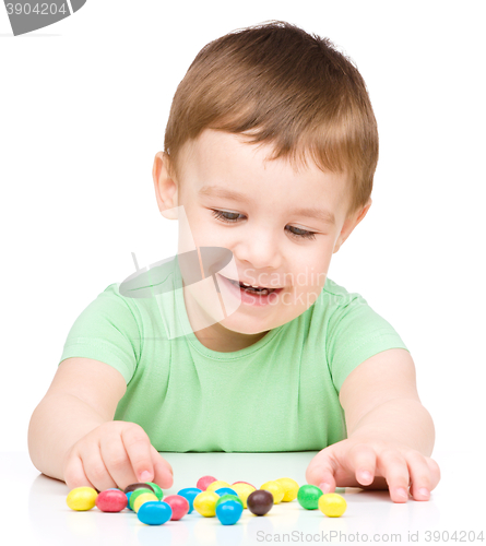 Image of Portrait of a boy with candies