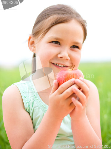 Image of Portrait of a little girl with apple