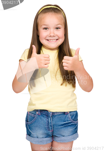 Image of Little girl is showing thumb up gesture