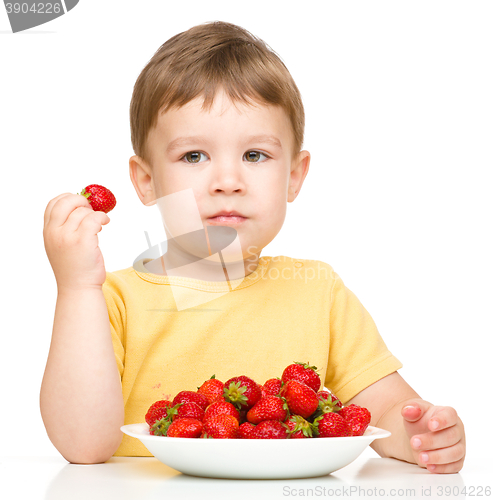 Image of Little boy with strawberries